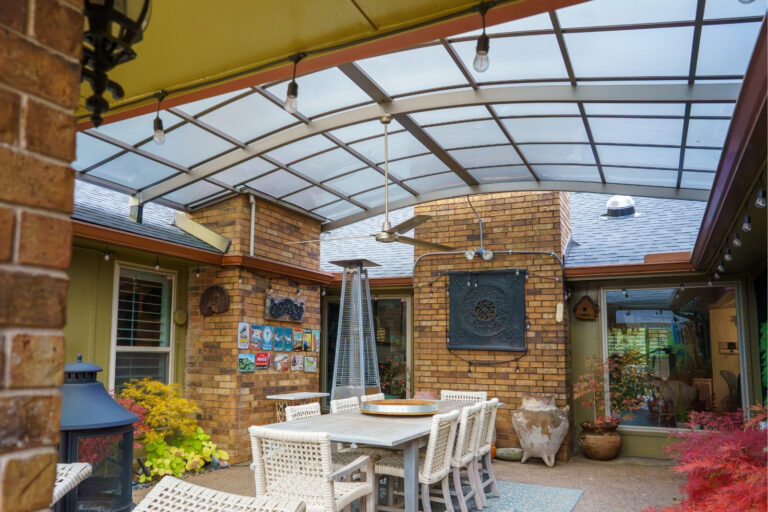 Custom roof-mounted PJW Series aluminum patio cover in Urban Gray.